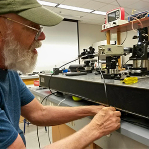 Instructor working with optical alignment equipment